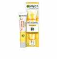 Återfuktande vätska Garnier Vitamin C - Invisible Anti-fläckar 40 ml